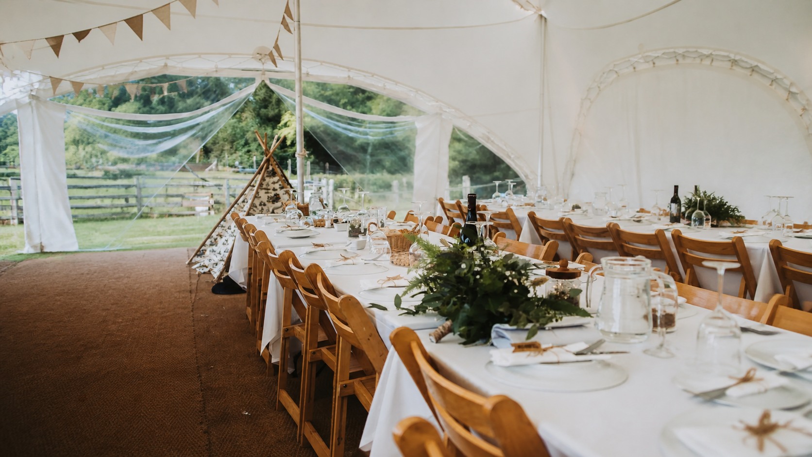 Decorated tables inside a Capri tent